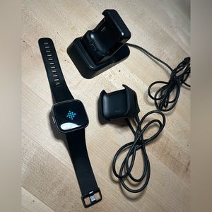 Fitbit Versa 2 with two chargers